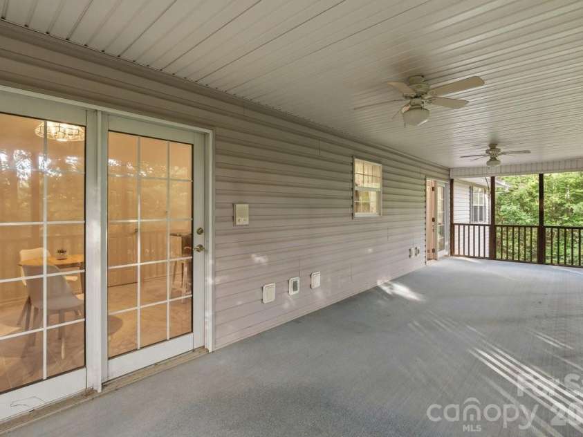 27 Red Maple Drive, Weaverville, NC 28787.  MLS# CAR4389807, YatesRealty ID 38392. Spacious back deck screened and covered.