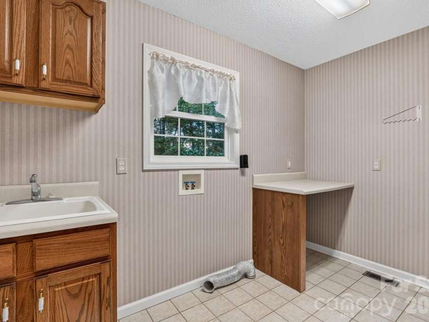 27 Red Maple Drive, Weaverville, NC 28787.  MLS# CAR4389807, YatesRealty ID 38392. Spacious laundry room