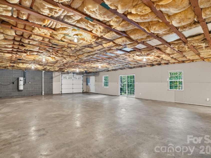 27 Red Maple Drive, Weaverville, NC 28787.  MLS# CAR4389807, YatesRealty ID 38392. Walk-out sliding doors and garage access