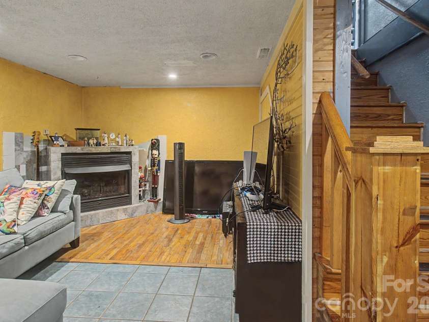 25 Wentworth Avenue, Asheville, NC 28803.  MLS# CAR4404172, YatesRealty ID 38404. Den in walkout basement