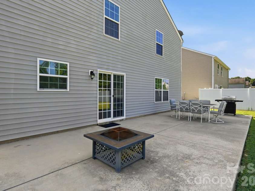 4734 Manchineel Lane, Monroe, NC 28110.  MLS# CAR4399318, YatesRealty ID 38409. Back Patio