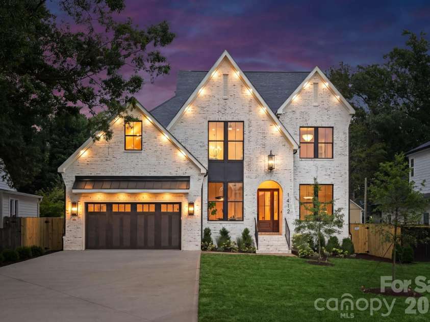 1412 Lyon Court, Charlotte, NC 28205.  MLS# CAR4398680, YatesRealty ID 38410. Front view at twilight.