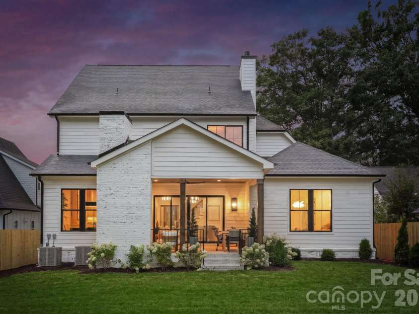 1412 Lyon Court, Charlotte, NC 28205.  MLS# CAR4398680, YatesRealty ID 38410. Rear view at twilight.