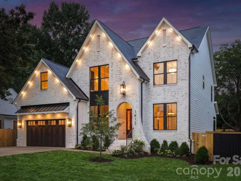 1412 Lyon Court, Charlotte, NC 28205.  MLS# CAR4398680, YatesRealty ID 38410. Side view at twilight.