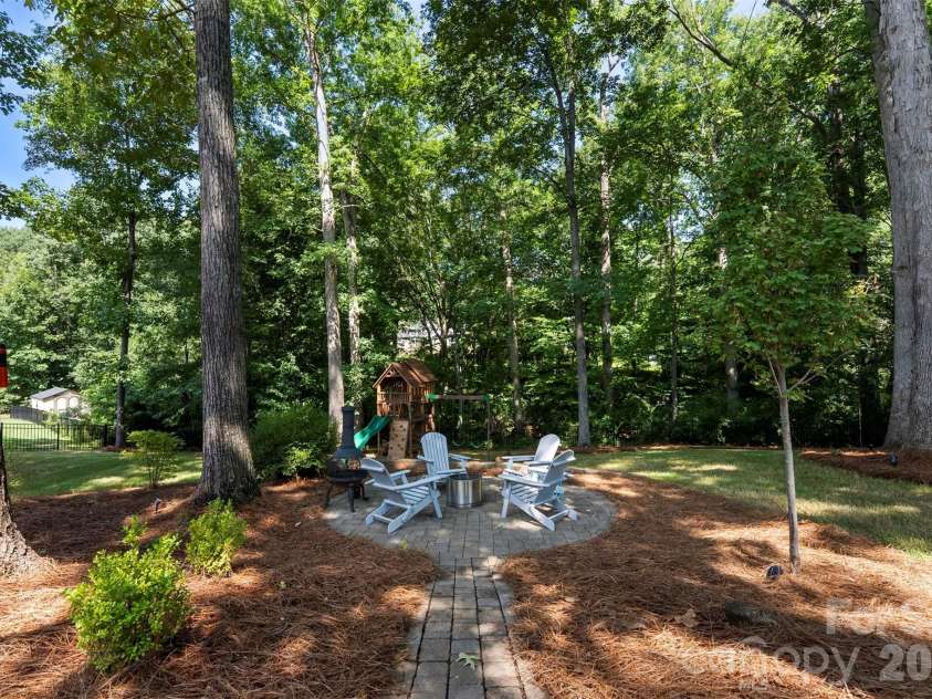 4066 Belle Meade Circle, Belmont, NC 28012.  MLS# CAR4402029, YatesRealty ID 38411. Backyard fire pit area