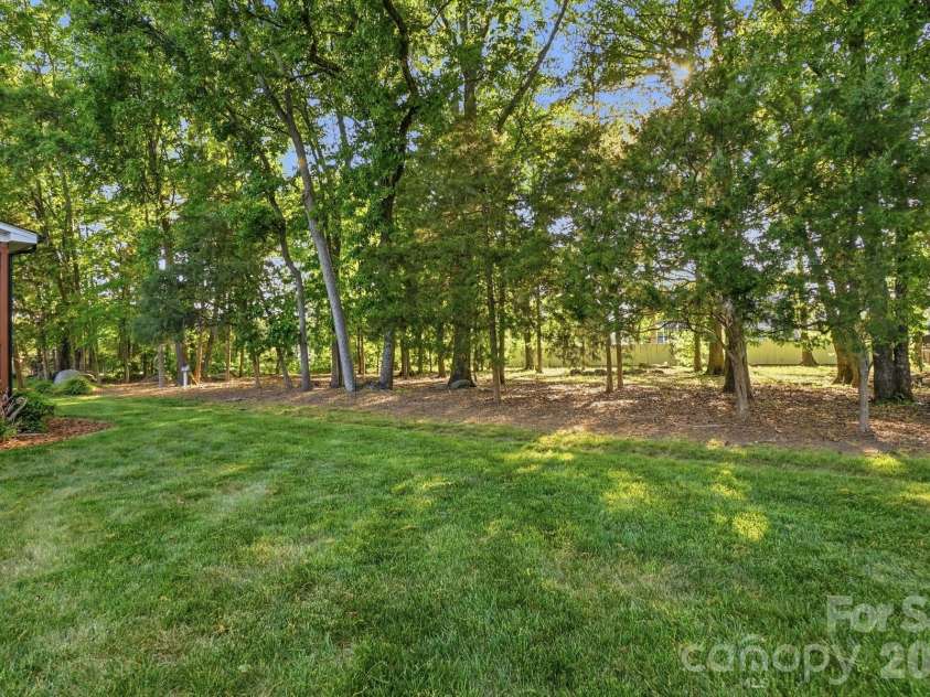 7650 Cotton Street, Harrisburg, NC 28075.  MLS# CAR4393142, YatesRealty ID 38431. Backyard