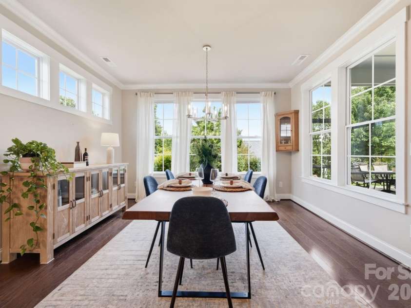 1012 Overlake Drive, Belmont, NC 28012.  MLS# CAR4400980, YatesRealty ID 38441. Light drenched dining room featuring private garden views