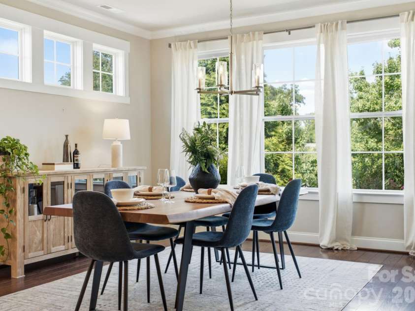 1012 Overlake Drive, Belmont, NC 28012.  MLS# CAR4400980, YatesRealty ID 38441. Light drenched dining room featuring private garden views