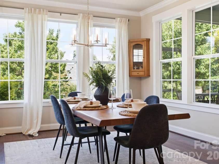 1012 Overlake Drive, Belmont, NC 28012.  MLS# CAR4400980, YatesRealty ID 38441. Light drenched dining room featuring private garden views