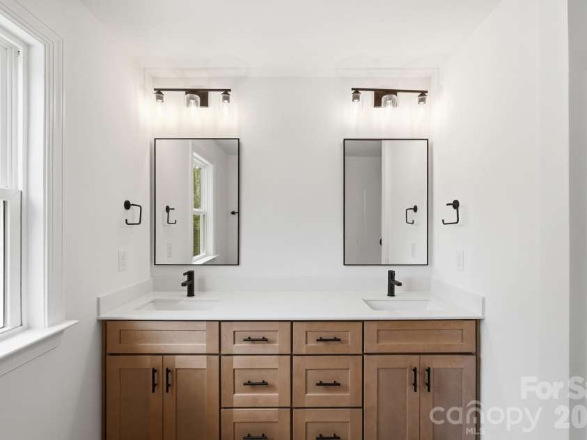 210 8th Avenue Drive, Hickory, NC 28602.  MLS# CAR4400461, YatesRealty ID 38442. Dual Sinks & Mirrors in Primary Ensuite Bathroom