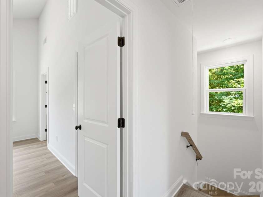 210 8th Avenue Drive, Hickory, NC 28602.  MLS# CAR4400461, YatesRealty ID 38442. Primary Bedroom Entrance from Stairs from Lower Level