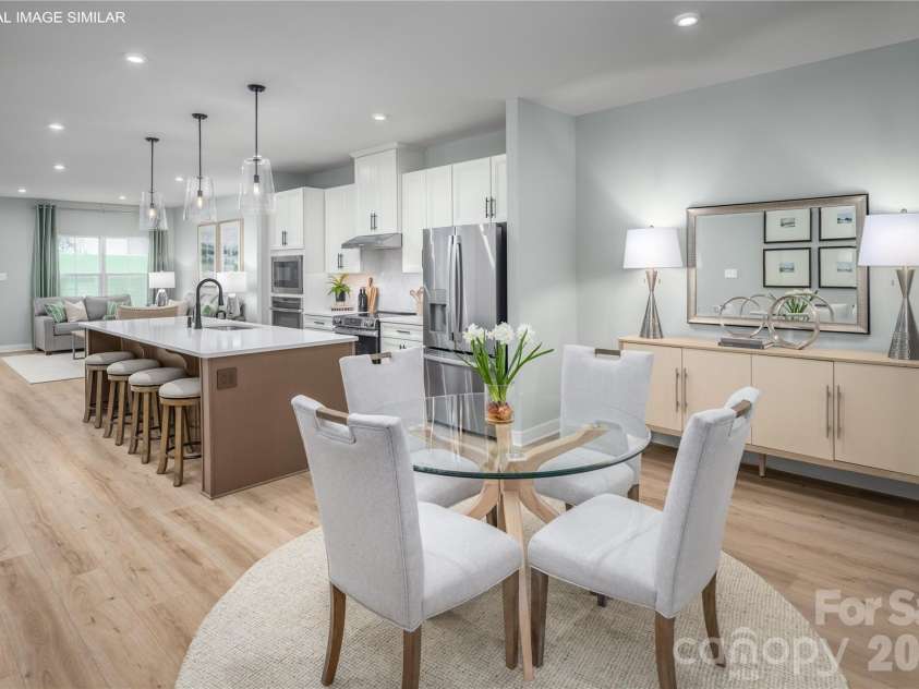 11162 Emerson Landing Drive, Charlotte, NC 28214.  MLS# CAR4398734, YatesRealty ID 38448. Open kitchen and dining space that flows easily for meals, hosting, and daily life.