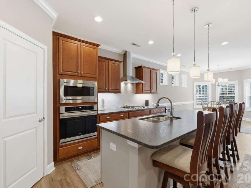 2525 Whispering Way, Indian Trail, NC 28079.  MLS# CAR4356535, YatesRealty ID 3846. Kitchen with granite counters and stainless appliances