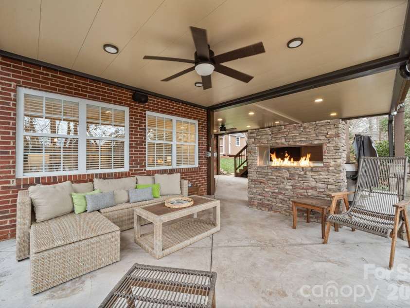 4685 Eagle Pointe Court, Denver, NC 28037.  MLS# CAR4332859, YatesRealty ID 38484. Double-sided gas fireplace with stone surround