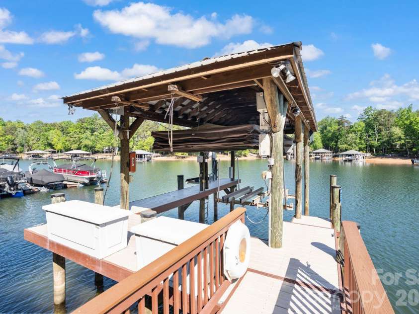 4685 Eagle Pointe Court, Denver, NC 28037.  MLS# CAR4332859, YatesRealty ID 38484. Motorized, automatic, touchless boat cover with remote and Jet Ski remote-powered lift.