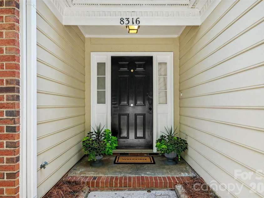 8316 Rhian Brook Lane, Charlotte, NC 28216.  MLS# CAR4402684, YatesRealty ID 38488. Inviting covered entrance