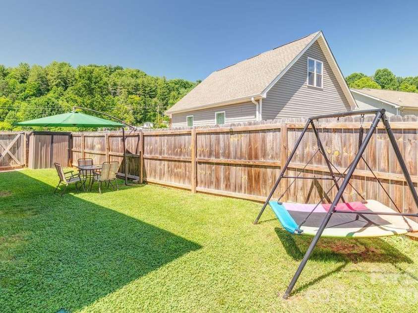 40 Quinn Hill Lane, Mars Hill, NC 28754.  MLS# CAR4395891, YatesRealty ID 38489. Side Yard.