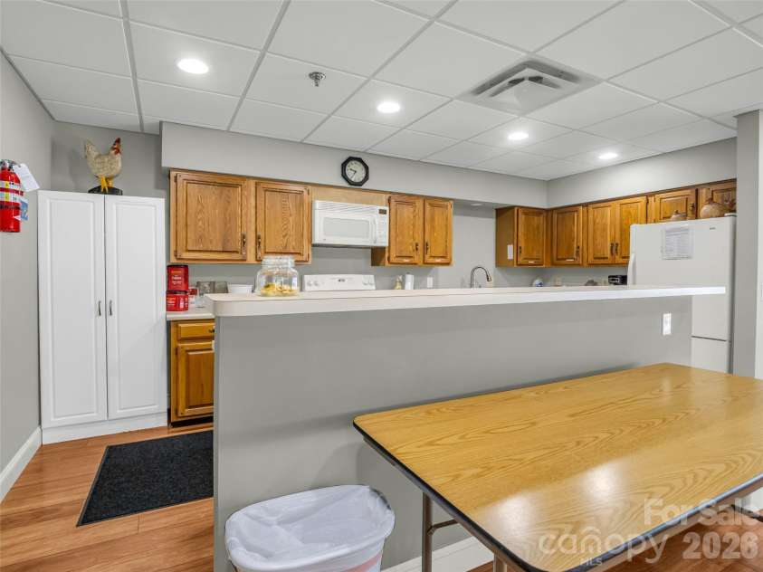 102 White Oak Drive, Hendersonville, NC 28791.  MLS# CAR4376604, YatesRealty ID 38494. Kitchen In Community Building