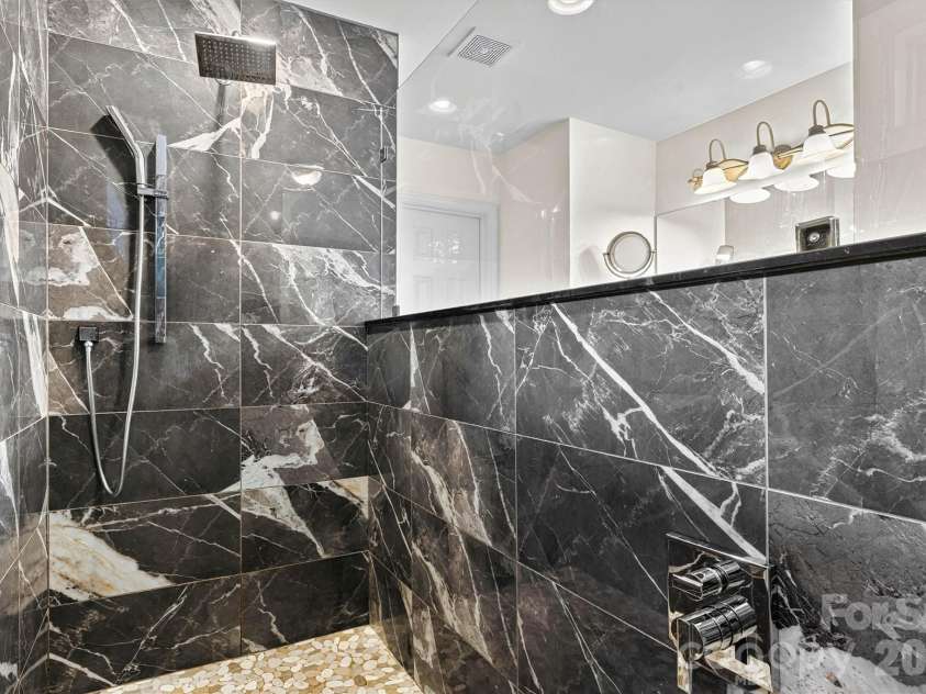 7542 Sedgebrook Drive, Stanley, NC 28164.  MLS# CAR4401228, YatesRealty ID 38497. Beautiful updated shower in primary bath