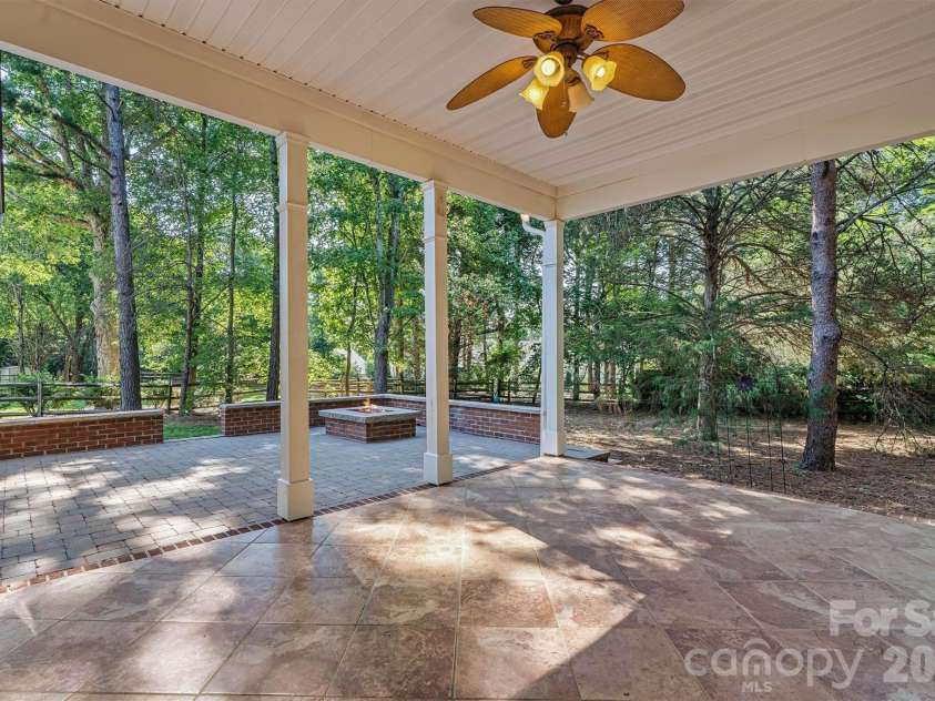 7542 Sedgebrook Drive, Stanley, NC 28164.  MLS# CAR4401228, YatesRealty ID 38497. Covered patio w/ ceiling fan