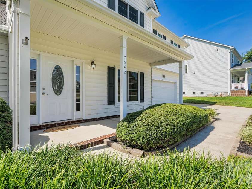7542 Sedgebrook Drive, Stanley, NC 28164.  MLS# CAR4401228, YatesRealty ID 38497. Rocking Chair Front Porch