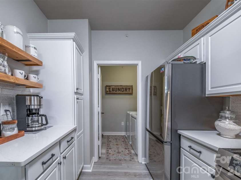 17110 Red Feather Drive, Charlotte, NC 28277.  MLS# CAR4397638, YatesRealty ID 38499. Kitchen to Laundry