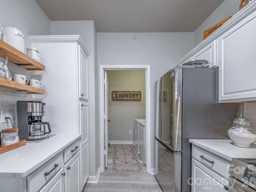 17110 Red Feather Drive, Charlotte, NC 28277.  MLS# CAR4397638, YatesRealty ID 38499. Kitchen to Laundry
