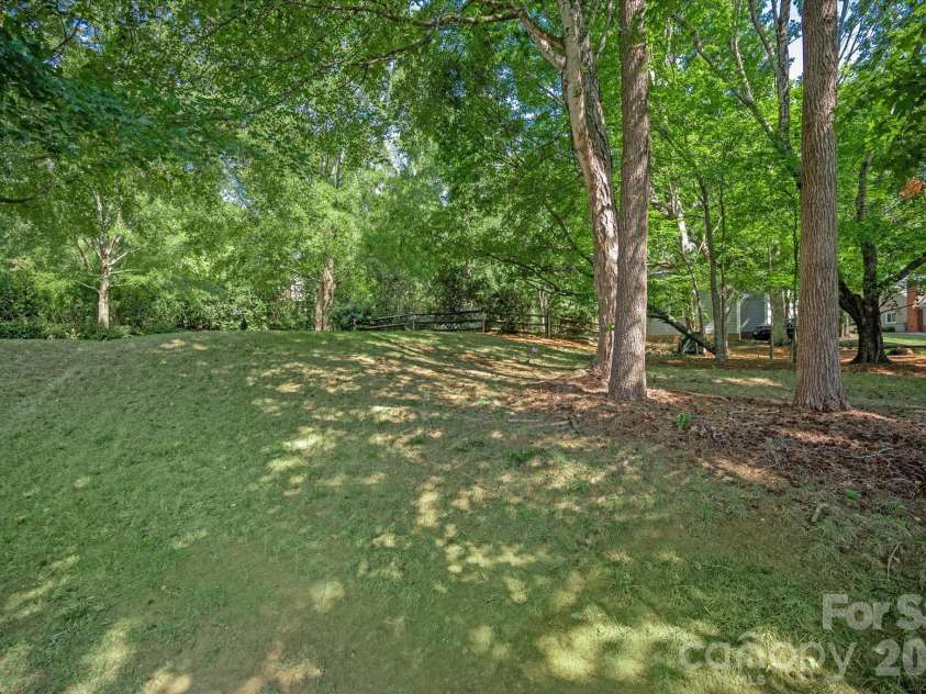 9801 Deer Spring Lane, Charlotte, NC 28210.  MLS# CAR4404766, YatesRealty ID 38506. Lovely wooded lot