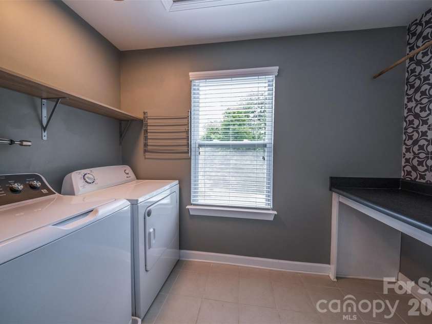 2134 Gillette Drive, Clover, SC 29710.  MLS# CAR4405603, YatesRealty ID 38521. Large Laundry Room with Built Ins and Folding counter