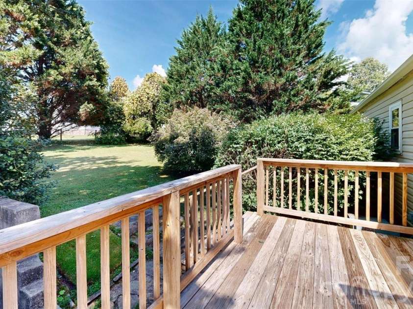 331 Probart Street, Brevard, NC 28712.  MLS# CAR4405723, YatesRealty ID 38535. Private rear deckOverlooking spacious and private level yard with mature landscaping.