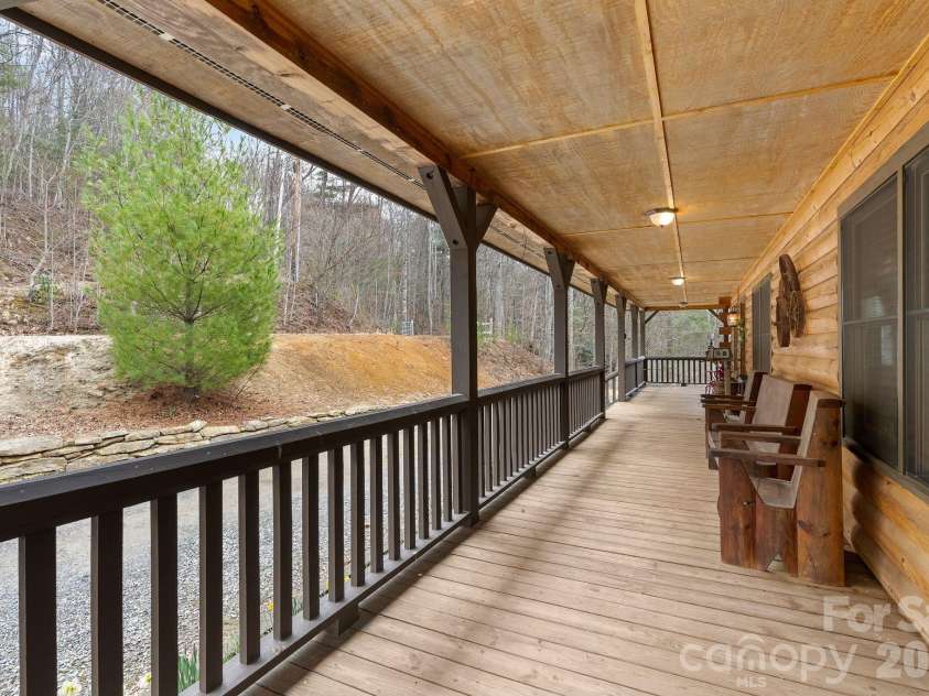 264 Moonbeam Lane, Clyde, NC 28721.  MLS# CAR4344576, YatesRealty ID 3856. Beautiful wrap around porch