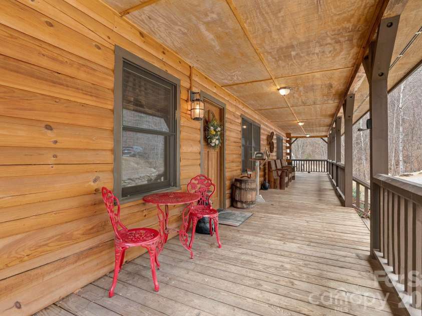 264 Moonbeam Lane, Clyde, NC 28721.  MLS# CAR4344576, YatesRealty ID 3856. Beautiful wrap around porch