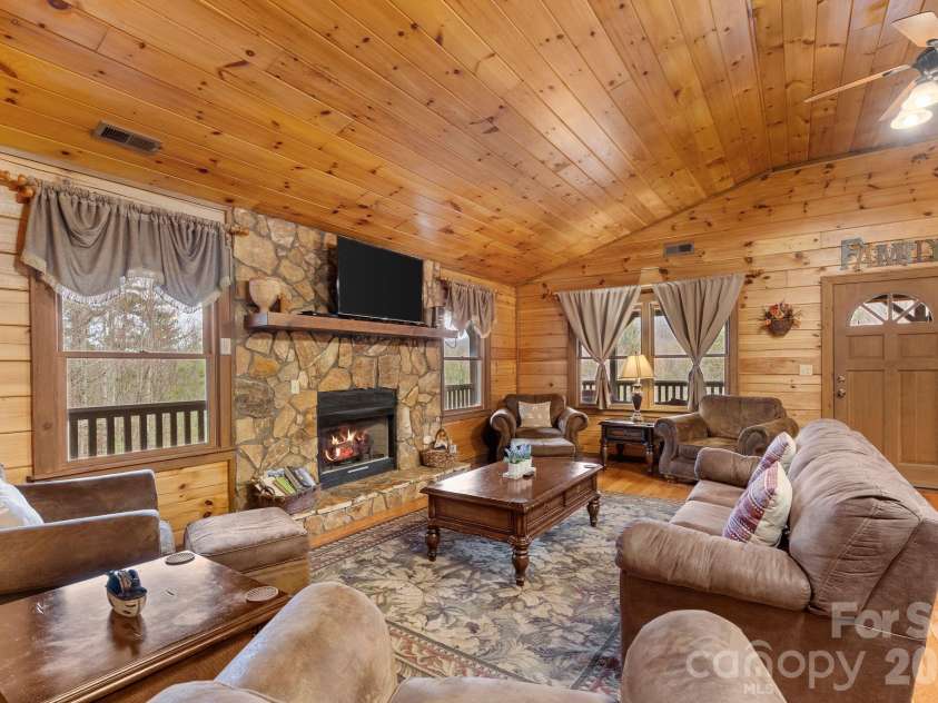 264 Moonbeam Lane, Clyde, NC 28721.  MLS# CAR4344576, YatesRealty ID 3856. Living room up 