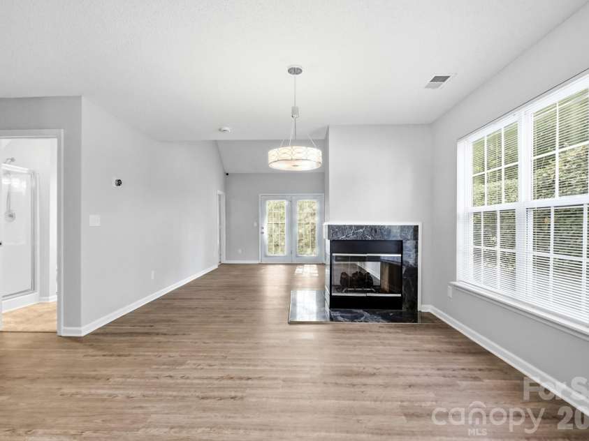 6068 Bobcat Place, Charlotte, NC 28269.  MLS# CAR4383046, YatesRealty ID 38581. View from kitchen into greatroom.