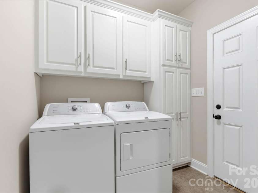 7882 Ballentrae Place, Stanley, NC 28164.  MLS# CAR4388967, YatesRealty ID 38586. Main-level laundry and practical everyday storage