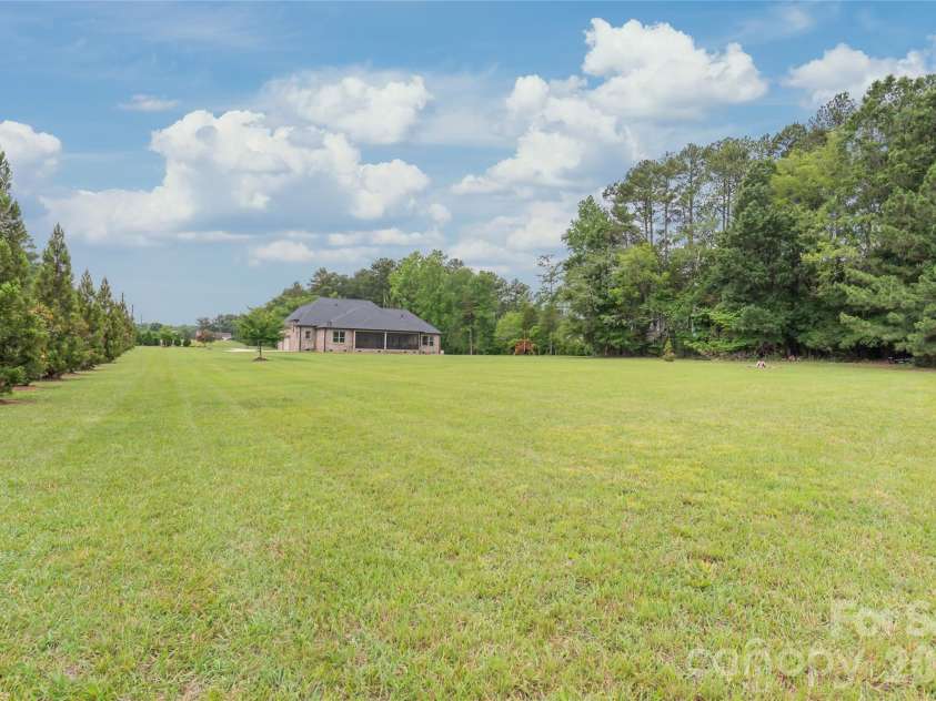 1808 Huntley Ridge Drive, Concord, NC 28025.  MLS# CAR4401612, YatesRealty ID 38588. Level Backyard Offers Endless Possibilites