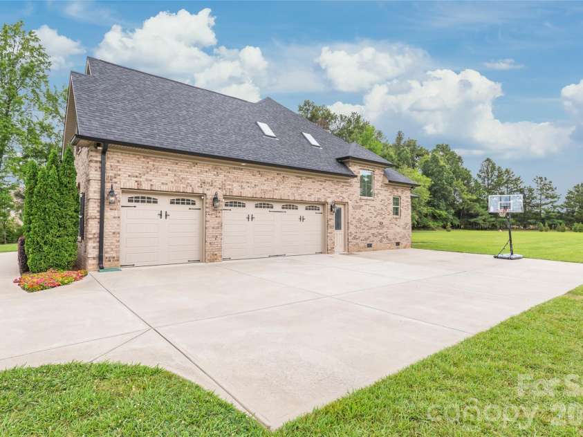 1808 Huntley Ridge Drive, Concord, NC 28025.  MLS# CAR4401612, YatesRealty ID 38588. Oversized Three-Car Garage