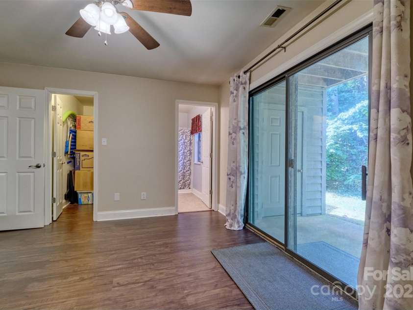 4130 Charlotte Highway, Lake Wylie, SC 29710.  MLS# CAR4276375, YatesRealty ID 3860. Bedroom 2 with patio access