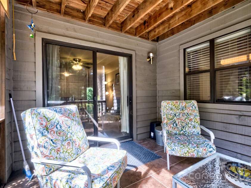 4130 Charlotte Highway, Lake Wylie, SC 29710.  MLS# CAR4276375, YatesRealty ID 3860. Front porch sitting area