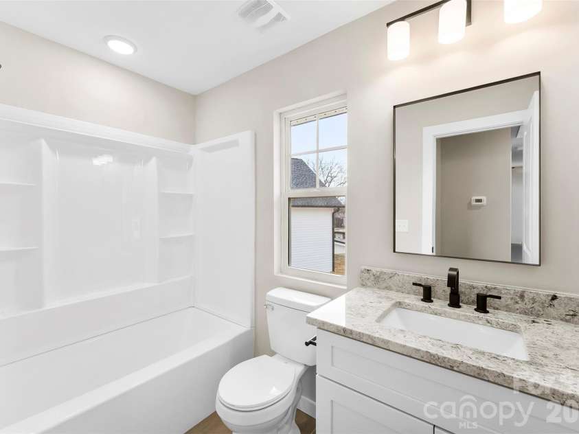 906 Brunett Street, Gastonia, NC 28052.  MLS# CAR4340368, YatesRealty ID 3860. Hall Full Bathroom Upstairs- Model Home