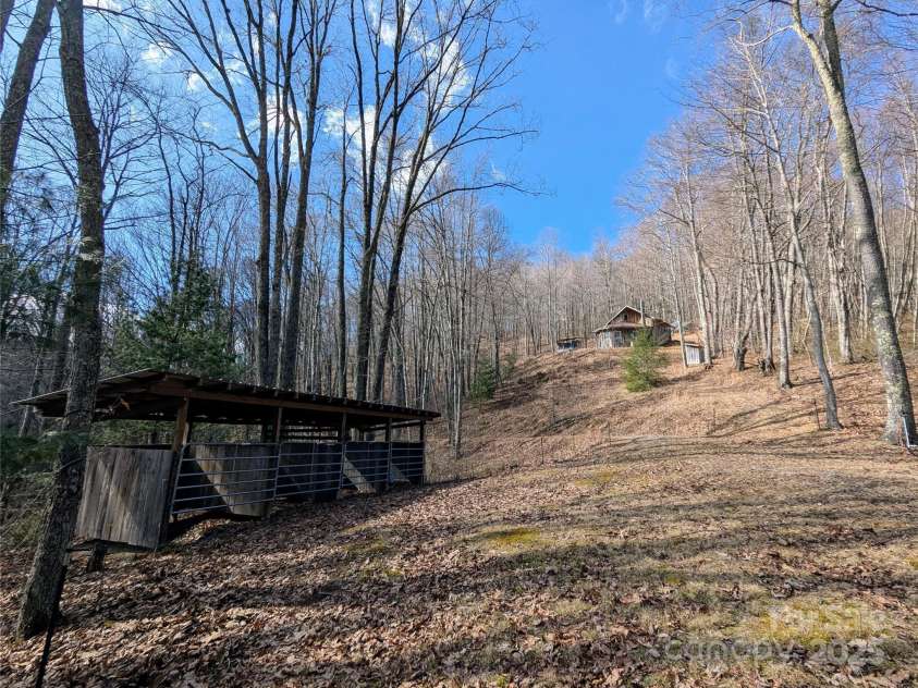 10120 Meadow Fork Road, Hot Springs, NC 28743.  MLS# CAR4218136, YatesRealty ID 3864. Looking up to the house from the stable area