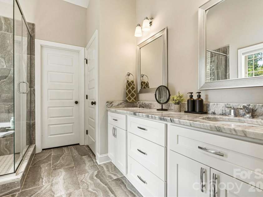 6515 Havencrest Drive, Denver, NC 28037.  MLS# CAR4403228, YatesRealty ID 38662. Ensuite Primary bath with tile shower and dual vanity