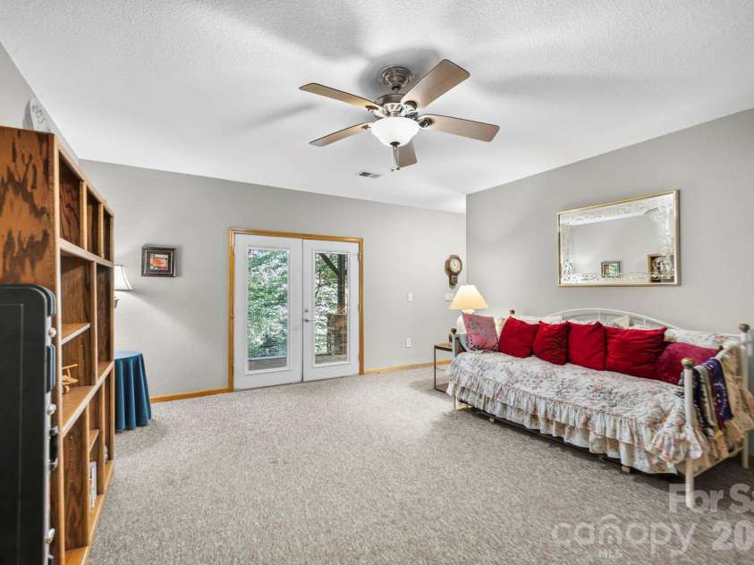 149 Oriole Road, Brevard, NC 28712.  MLS# CAR4404577, YatesRealty ID 38675. Spacious lower-level bonus room with private exterior access.