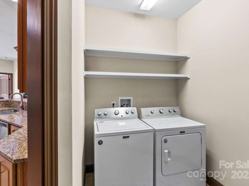 4 Pacifico Drive, Asheville, NC 28806.  MLS# CAR4318264, YatesRealty ID 3868. Pocket Doors off Kitchen Open to Laundry