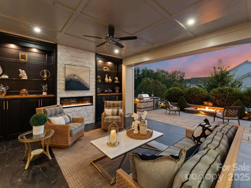 1035 Chippenham Avenue, Lancaster, SC 29720.  MLS# CAR4294660, YatesRealty ID 38680. Covered outdoor living with floor to ceiling cabinetry and electric fireplace.