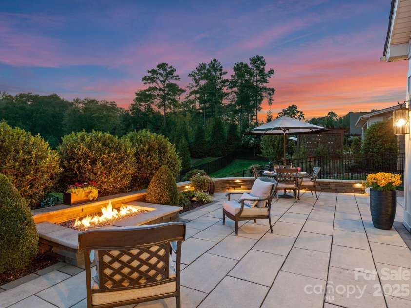 1035 Chippenham Avenue, Lancaster, SC 29720.  MLS# CAR4294660, YatesRealty ID 38680. Sunset views from the patio with cozy fire feature.