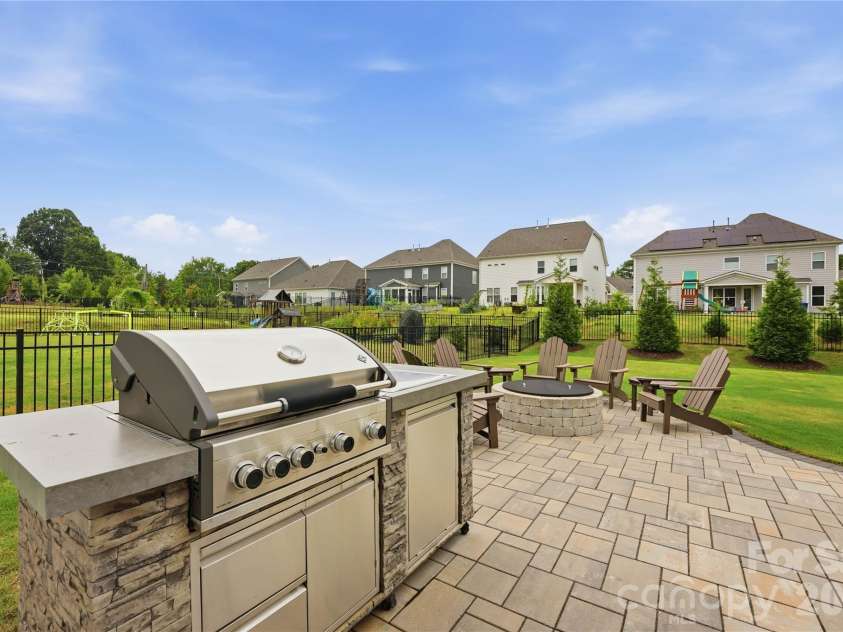 4010 Patsy Drive, Mint Hill, NC 28227.  MLS# CAR4403720, YatesRealty ID 38689. Gas grill and new paver patio