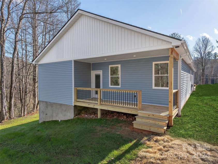 46 Smokey Quartz Lane, Flat Rock, NC 28731.  MLS# CAR4208463, YatesRealty ID 387. Back exterior/Grass edited