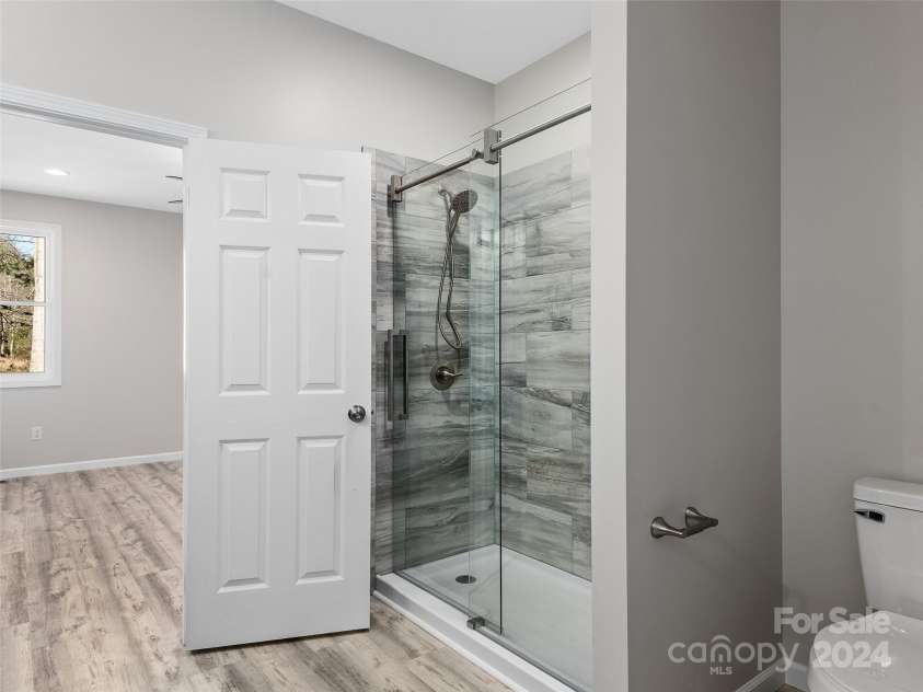46 Smokey Quartz Lane, Flat Rock, NC 28731.  MLS# CAR4208463, YatesRealty ID 387. Beautiful Step in Shower