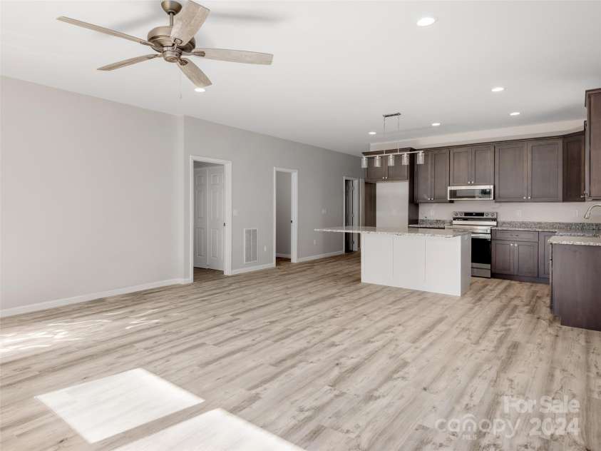 46 Smokey Quartz Lane, Flat Rock, NC 28731.  MLS# CAR4208463, YatesRealty ID 387. Living Room and Dining Area